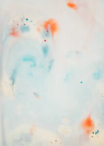 Pale blue and white marbled ink with orange blooms, used as the site background – photo by Annie Spratt
